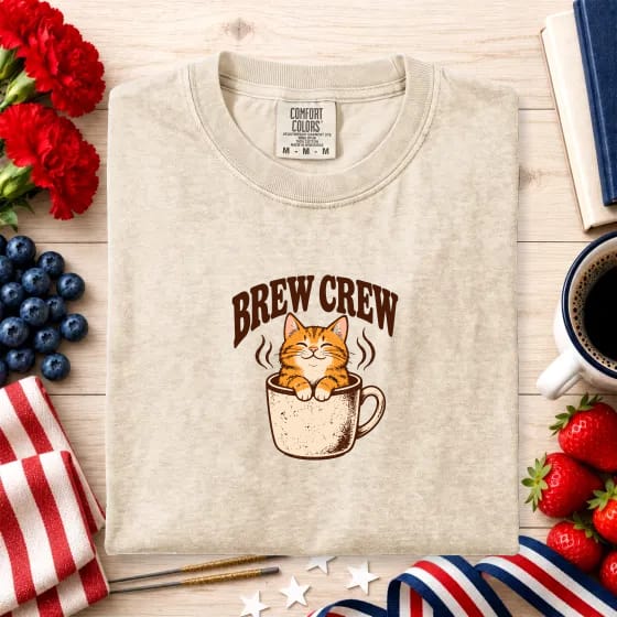 The same design on the same Ivory shirt, photographed on a 4th of July background